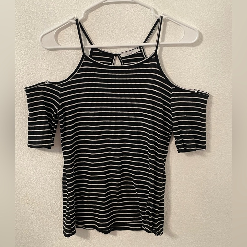 This is a black and white striped tank top with off the shoulder sleeves